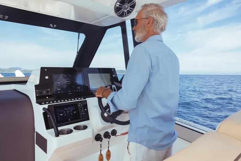 Slide: The Image of Man steering Zodiac X10CC boat on open sea, 2025 model. - 18