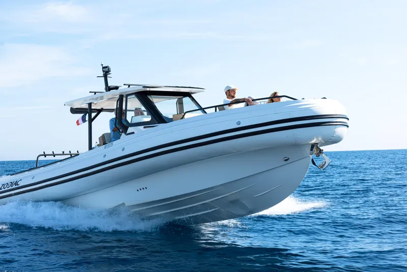 Slide: The Image of 2025 Zodiac X10CC boat cruising on open blue sea. - 23
