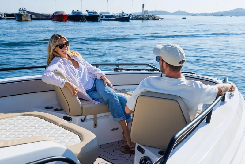 Slide: The Image of Couple relaxing on Zodiac X10CC boat, 2025 model, enjoying a sunny day on the water. - 24