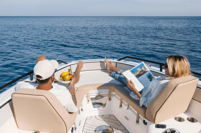 Slide: The Image of Couple relaxing on Zodiac X10CC boat, enjoying ocean view, 2025 model. - 6