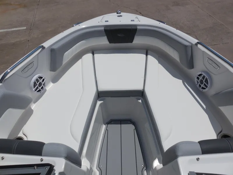 Slide: The Image of 2024 Chaparral 21 SSi boat interior with white and gray seating. - 10
