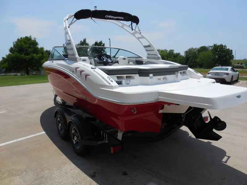 Slide: The Image of 2024 Chaparral 21 SSi boat on a trailer, rear view. - 4