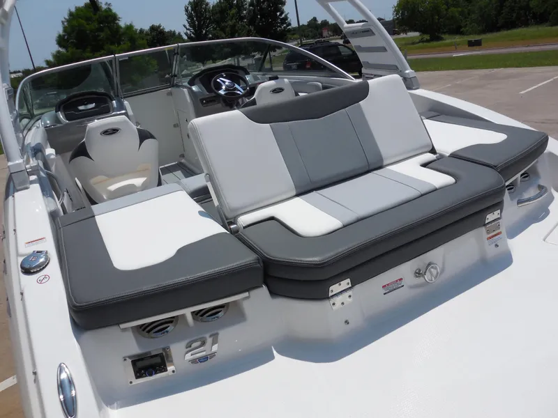 Slide: The Image of 2024 Chaparral 21 SSi boat interior with white and gray seating. - 6
