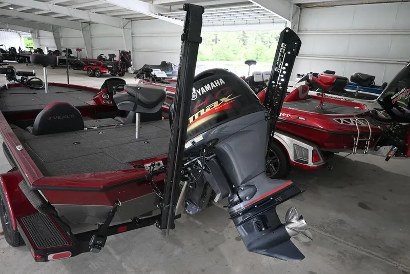 Slide: The Image of 2021 Vexus AVX1880 boat with Yamaha outboard motor in storage facility. - 4