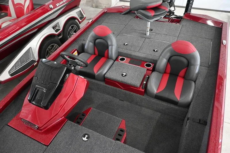 Slide: The Image of 2021 Vexus AVX1880 boat interior with red and black seats and steering console. - 8