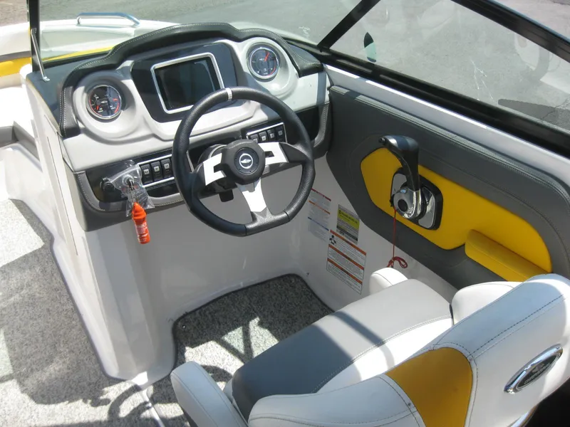 Slide: The Image of 2015 Chaparral 203 Vortex VRX boat cockpit with steering wheel and dashboard. - 11
