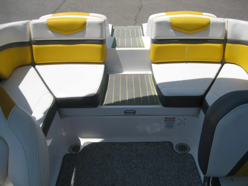 Slide: The Image of 2015 Chaparral 203 Vortex VRX boat interior with yellow and white seating. - 12
