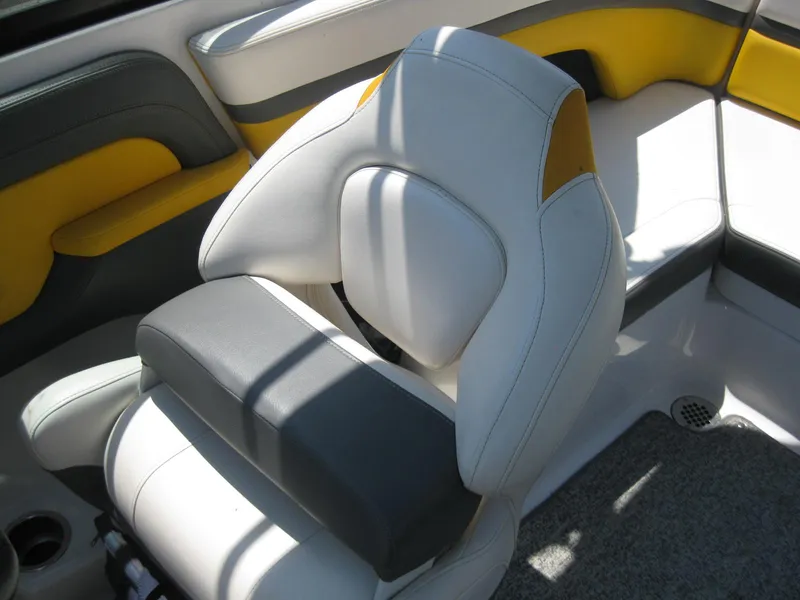 Slide: The Image of 2015 Chaparral 203 Vortex VRX boat interior with white, yellow, and gray seating. - 13