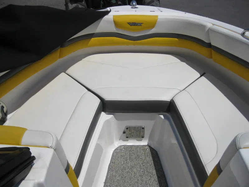 Slide: The Image of 2015 Chaparral 203 Vortex VRX boat interior with yellow and white seating. - 17