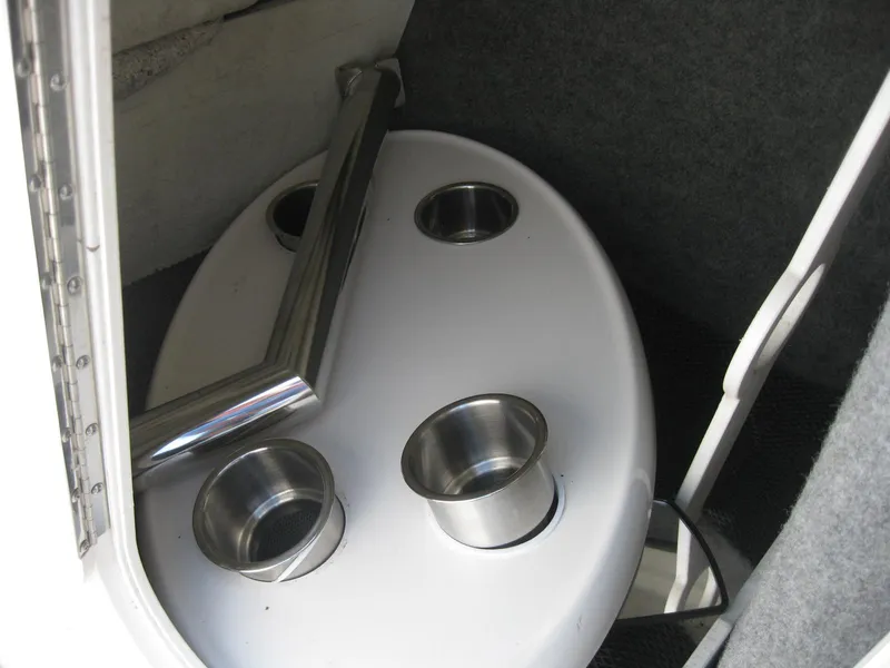 Slide: The Image of Cup holders and table inside a 2015 Chaparral 203 Vortex VRX boat. - 19