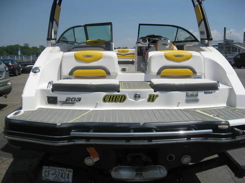Slide: The Image of 2015 Chaparral 203 Vortex VRX boat with yellow and white seating, rear view. - 6