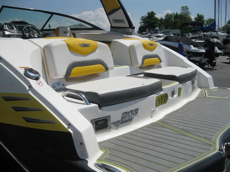 Slide: The Image of 2015 Chaparral 203 Vortex VRX boat with yellow and white seating. - 7