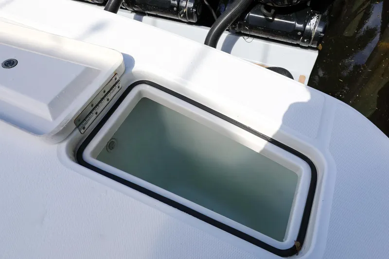 Slide: The Image of Livewell on a 2020 Regulator 41 boat, open lid, clean water inside. - 15