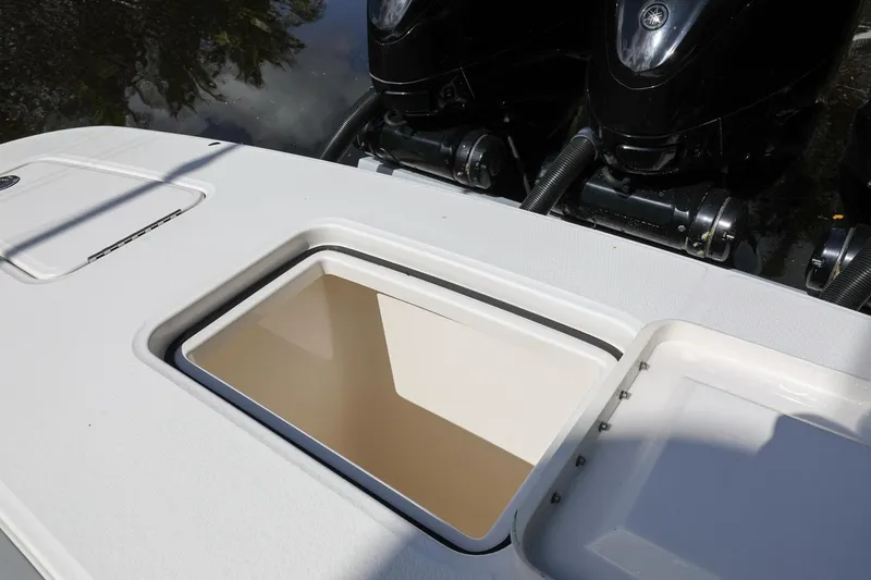 Slide: The Image of 2020 Regulator 41 boat with open storage compartment and dual outboard engines. - 16