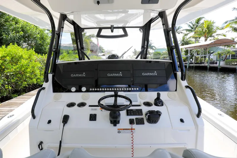 Slide: The Image of 2020 Regulator 41 boat helm with Garmin navigation systems. - 18