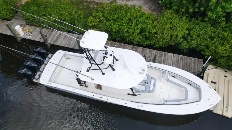 Slide: The Image of Aerial view of a 2020 Regulator 41 boat docked by a wooden pier. - 2