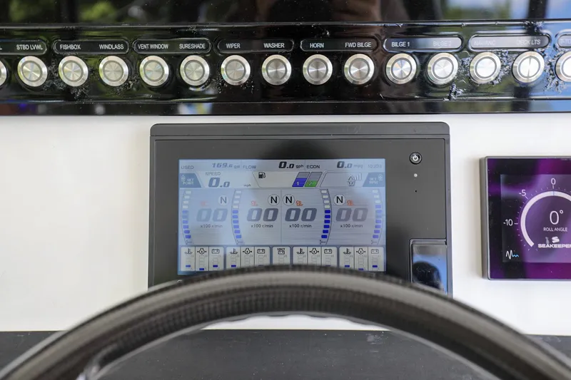 Slide: The Image of Control panel of a 2020 Regulator 41 boat with digital display and buttons. - 20