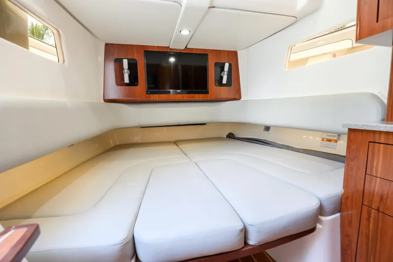 Slide: The Image of Luxurious cabin interior of 2020 Regulator 41 boat with TV and comfortable seating. - 26