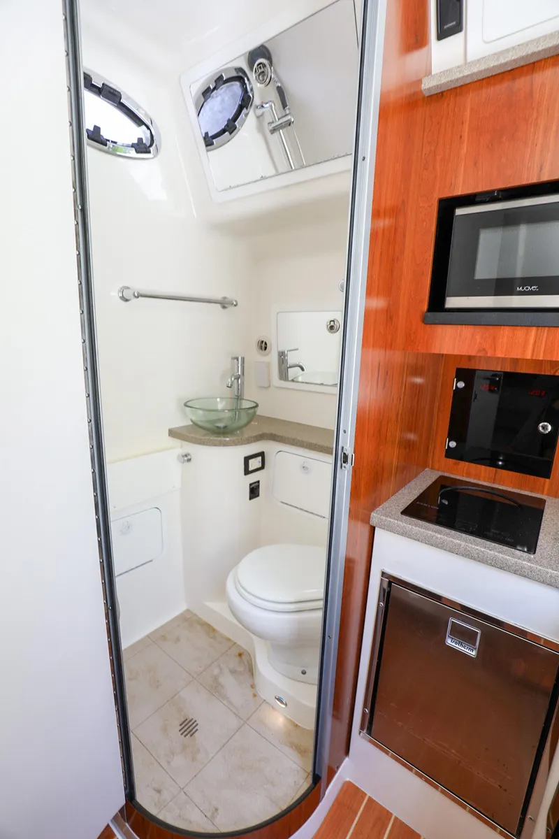 Slide: The Image of 2020 Regulator 41 boat interior bathroom with modern amenities. - 28