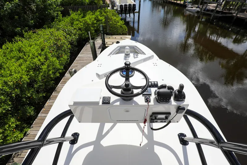 Slide: The Image of 2020 Regulator 41 boat helm station docked by a canal. - 40