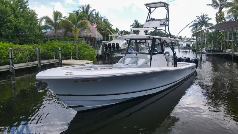 Slide: The Image of 2020 Regulator 41 boat docked in a tropical marina. - 6
