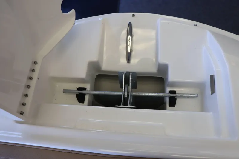 Slide: The Image of Anchor storage compartment on 2025 Sea Ray 250SDX boat, featuring secure metal fittings. - 19