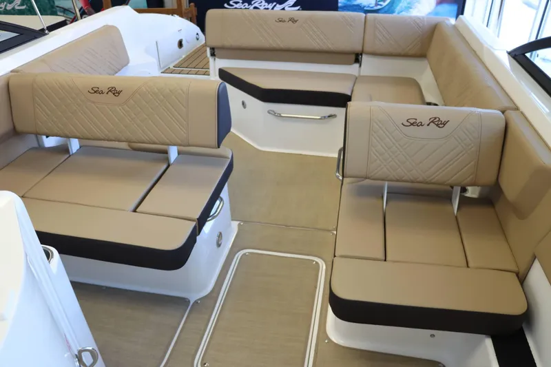 Slide: The Image of Luxurious seating on 2025 Sea Ray 250SDX boat, featuring beige upholstery and elegant design. - 22