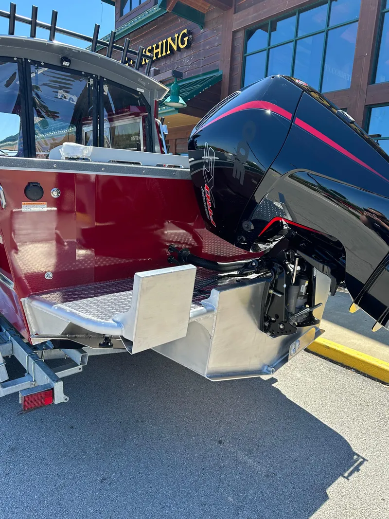 Slide: The Image of 2024 Spartan 220 Maximus boat with powerful outboard motor. - 11