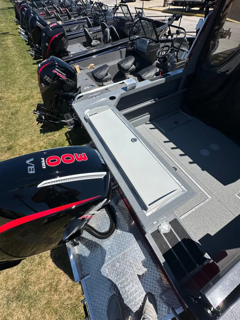 Slide: The Image of 2024 Spartan 220 Maximus boat with powerful outboard motor, spacious deck, and modern design. - 14