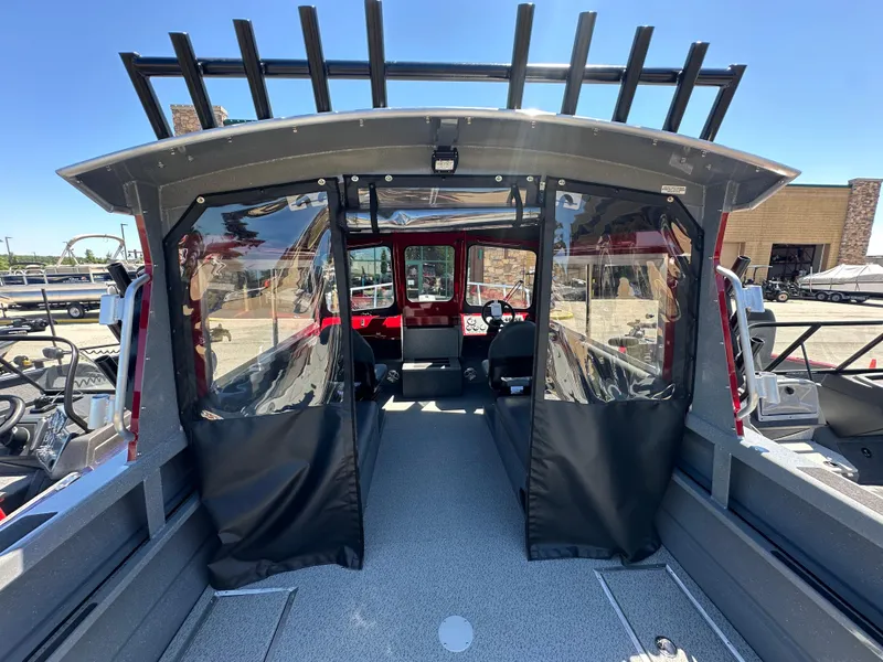 Slide: The Image of 2024 Spartan 220 Maximus boat interior with covered seating area. - 22