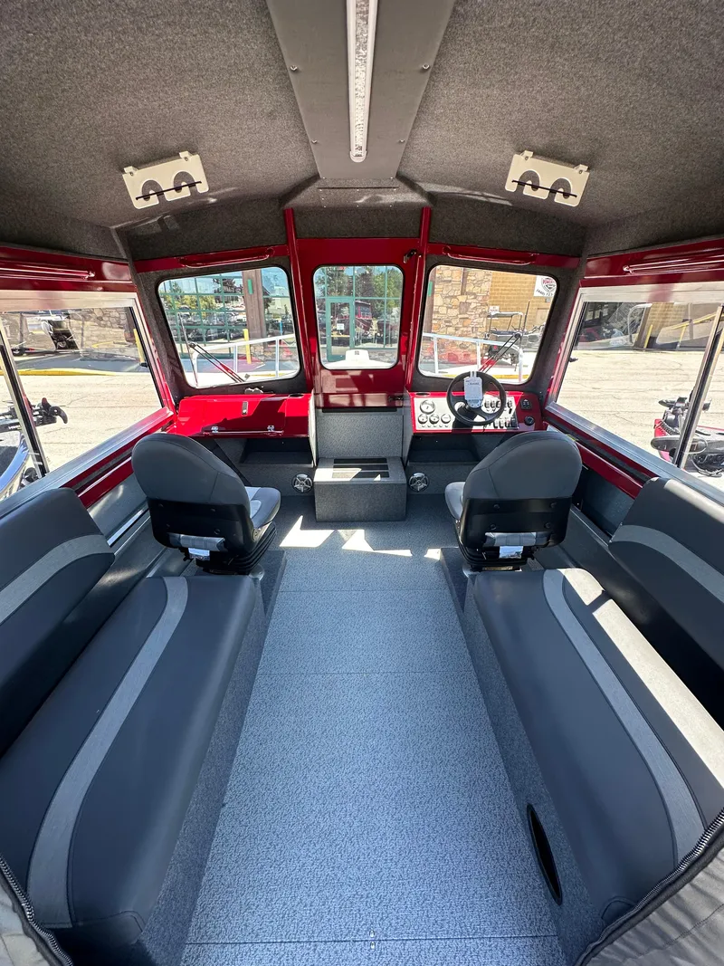 Slide: The Image of Interior of 2024 Spartan 220 Maximus boat with seating and control panel. - 23