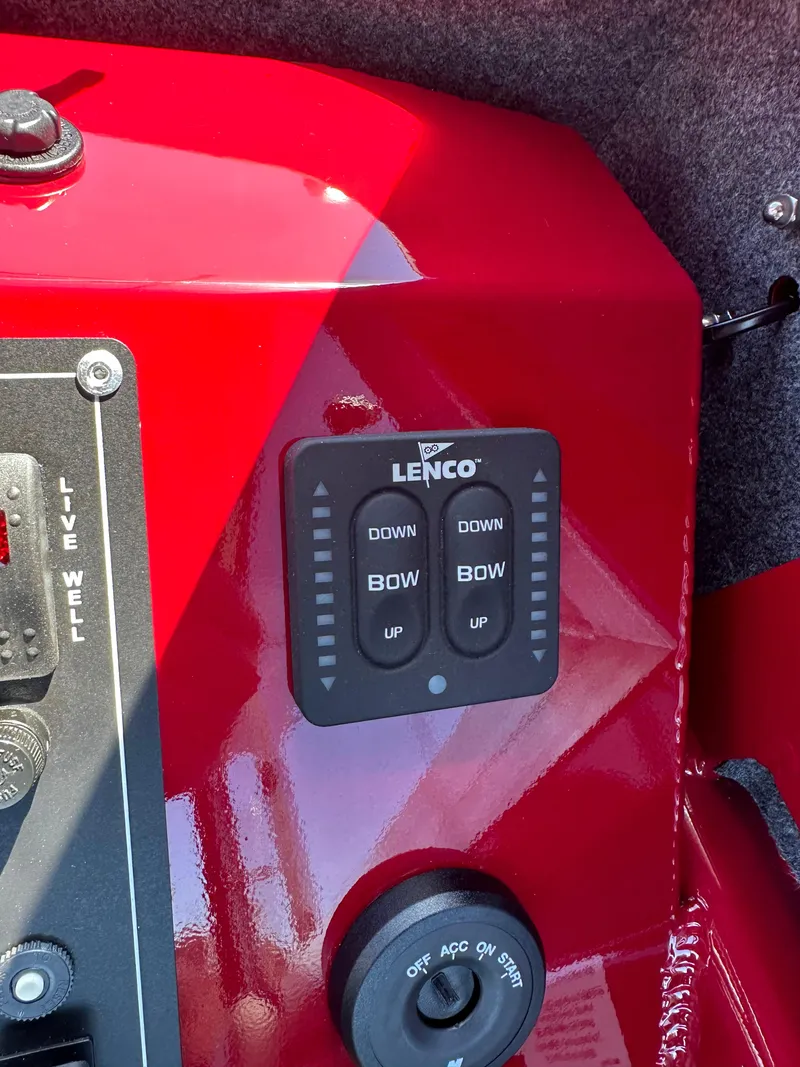 Slide: The Image of Control panel of a 2024 Spartan 220 Maximus boat with Lenco trim tab switches. - 27