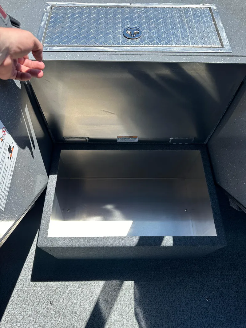 Slide: The Image of Open storage compartment in 2024 Spartan 220 Maximus boat. - 30