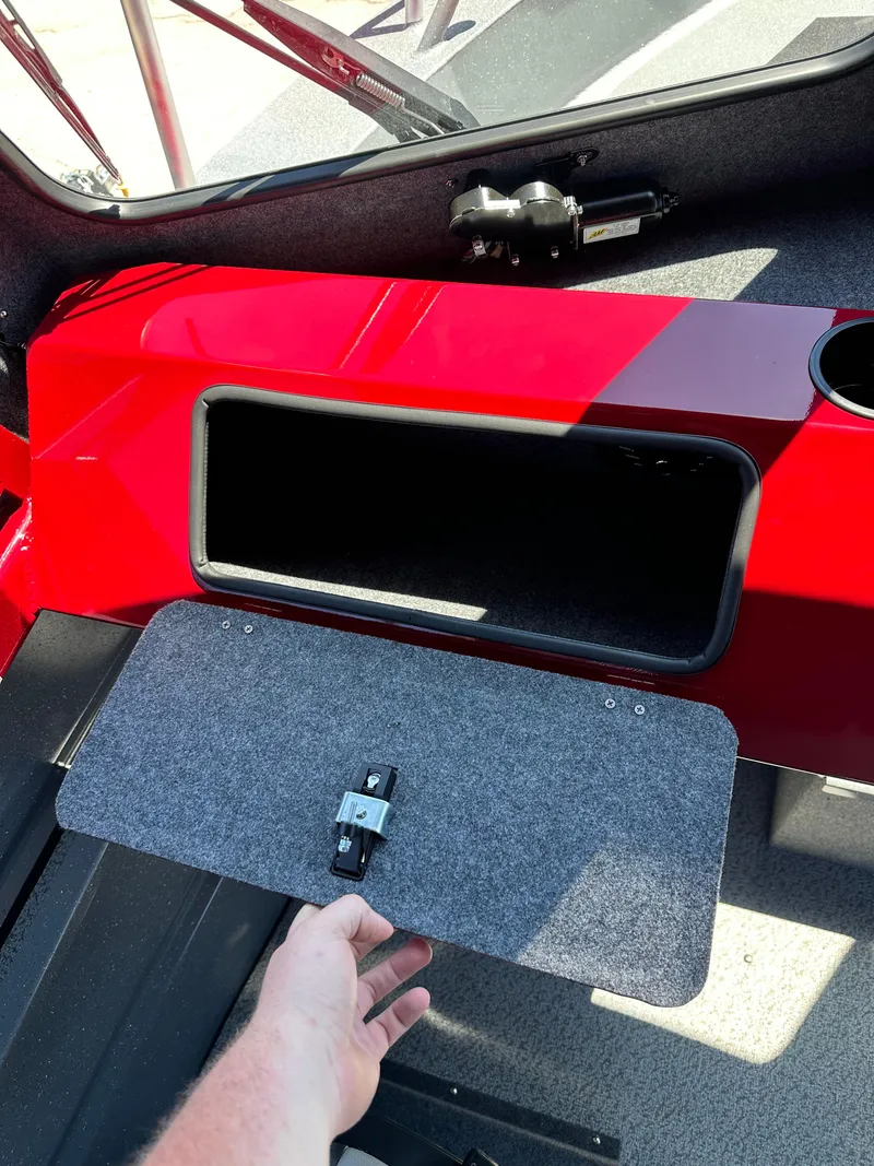 Slide: The Image of 2024 Spartan 220 Maximus storage compartment with open lid. - 34