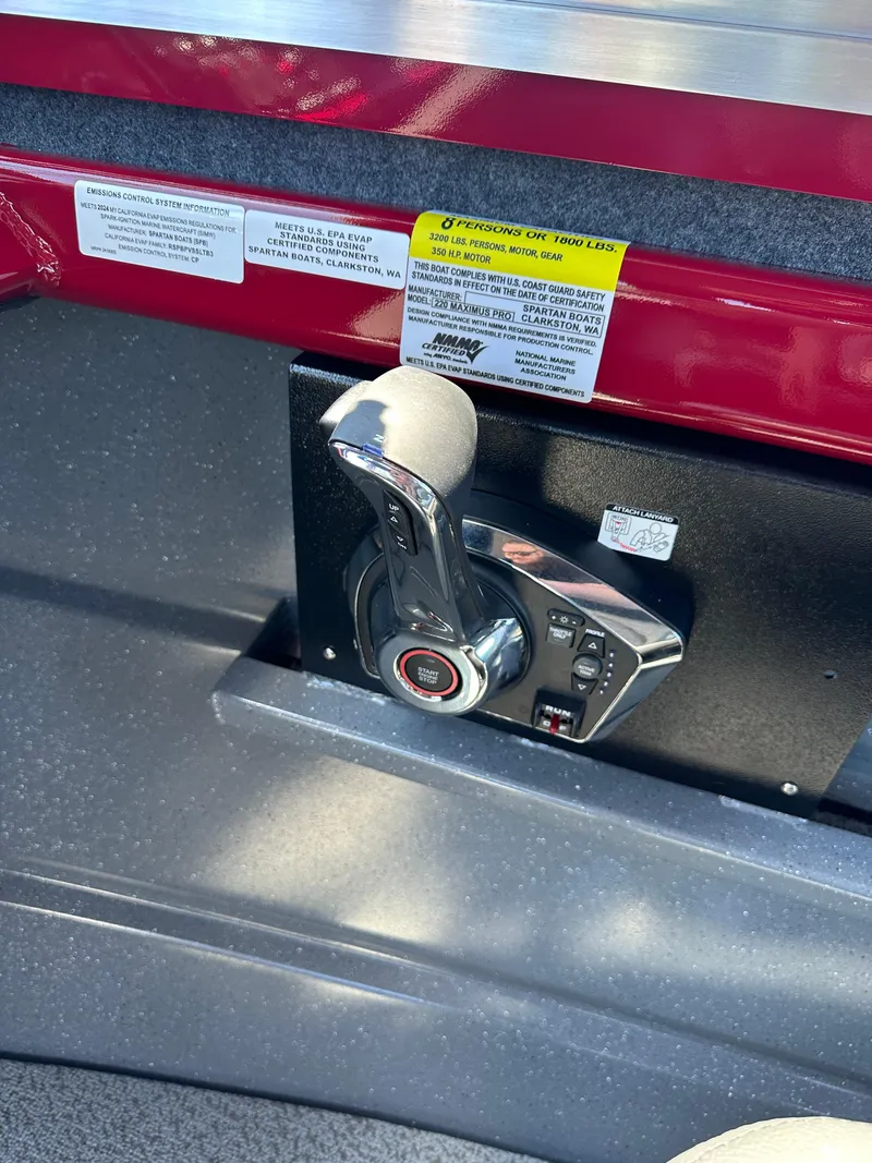 Slide: The Image of Control lever of a 2024 Spartan 220 Maximus boat. - 36