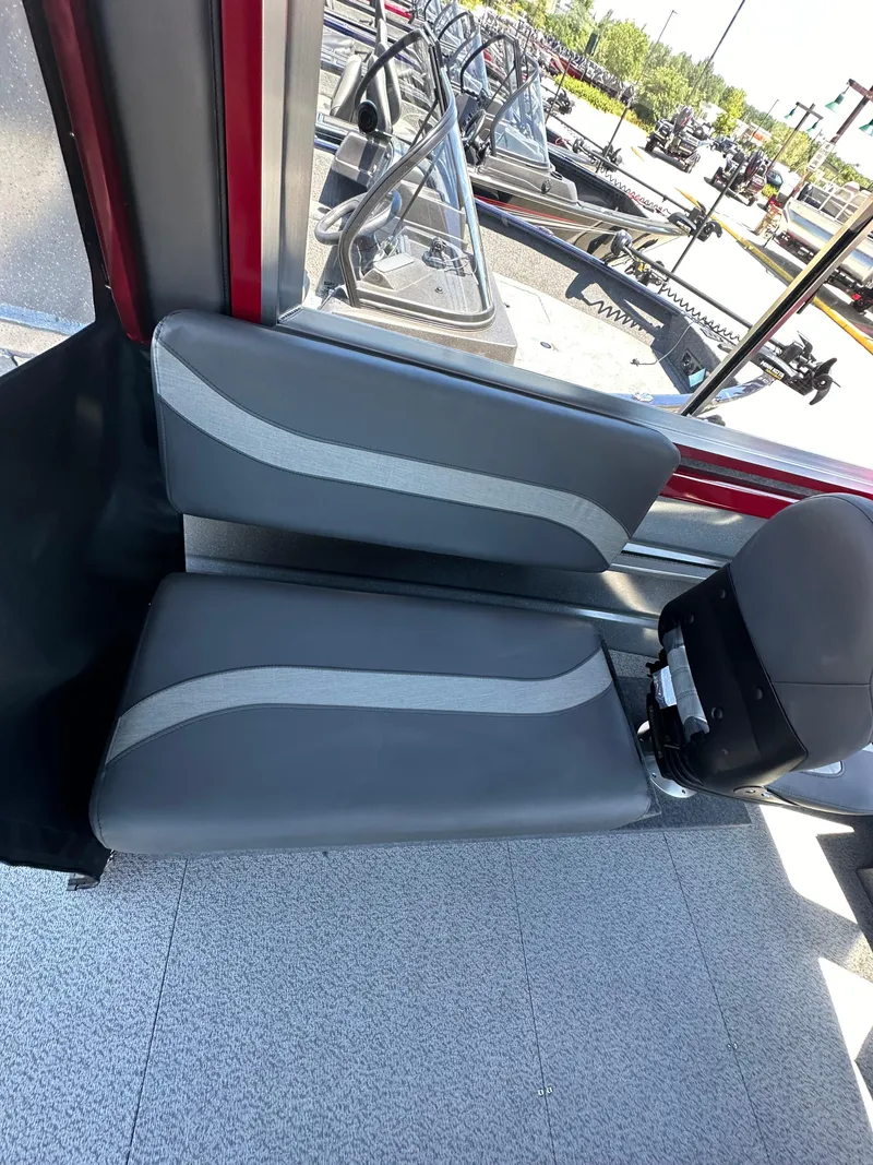 Slide: The Image of 2024 Spartan 220 Maximus boat interior with gray and white seating. - 41