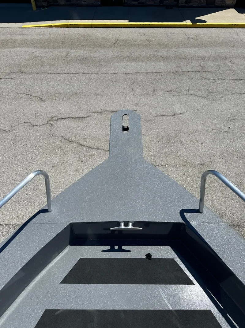 Slide: The Image of 2024 Spartan 220 Maximus boat bow on pavement. - 43