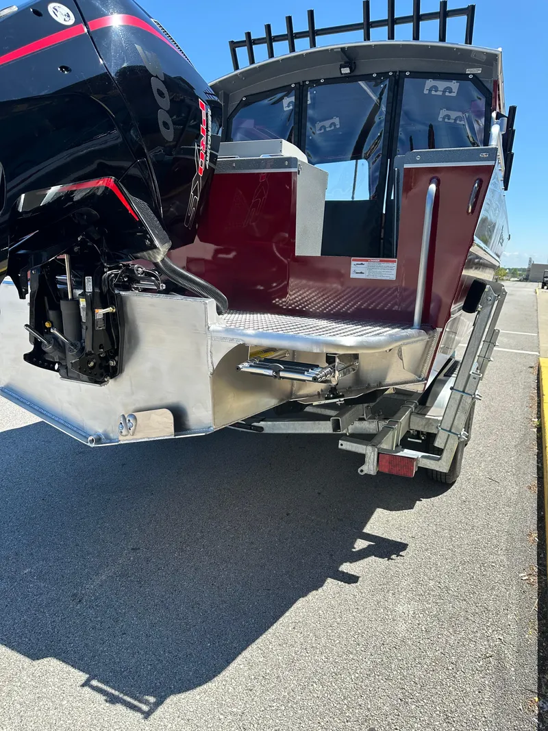 Slide: The Image of 2024 Spartan 220 Maximus boat with powerful outboard motor on trailer. - 8