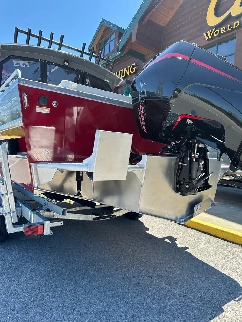 Slide: The Image of 2024 Spartan 220 Maximus boat with powerful outboard motor on trailer. - 9