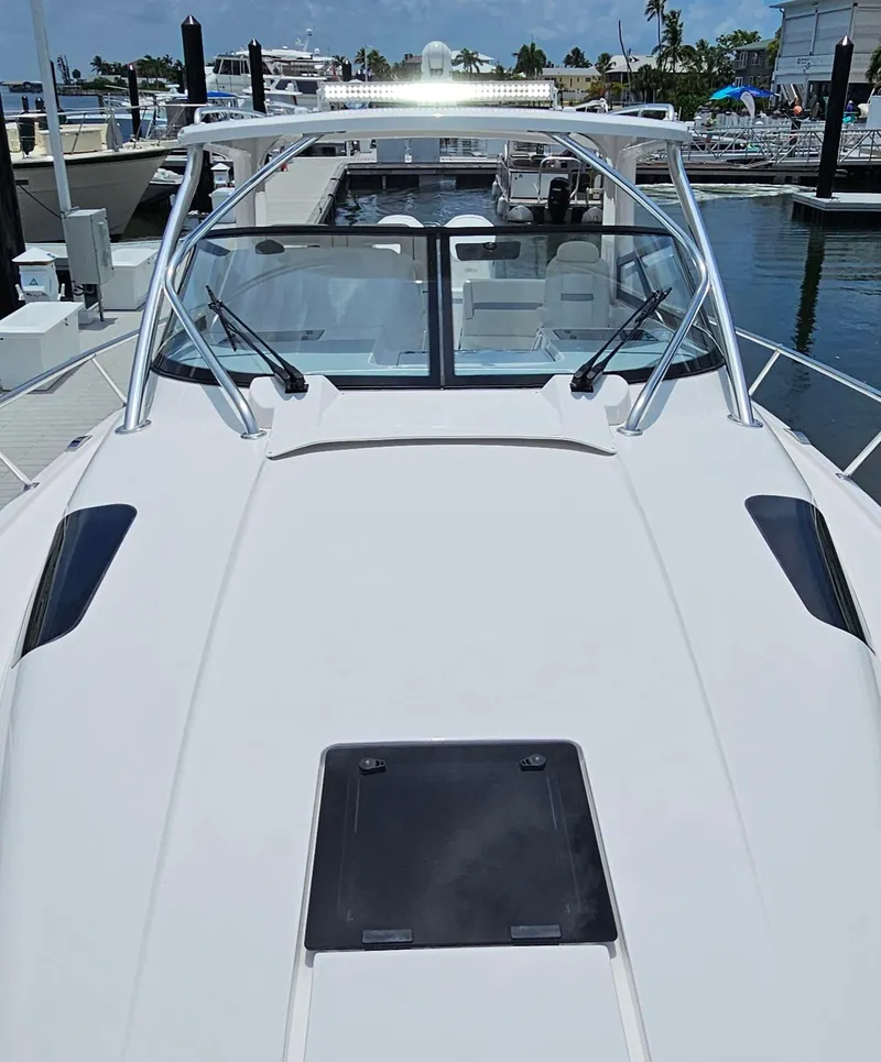 Slide: The Image of 2022 Intrepid 438 Evolution boat docked at a marina. - 20