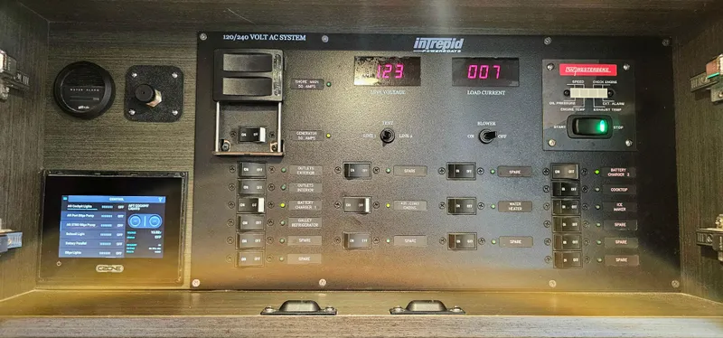 Slide: The Image of Electrical control panel of a 2022 Intrepid 438 Evolution boat. - 25
