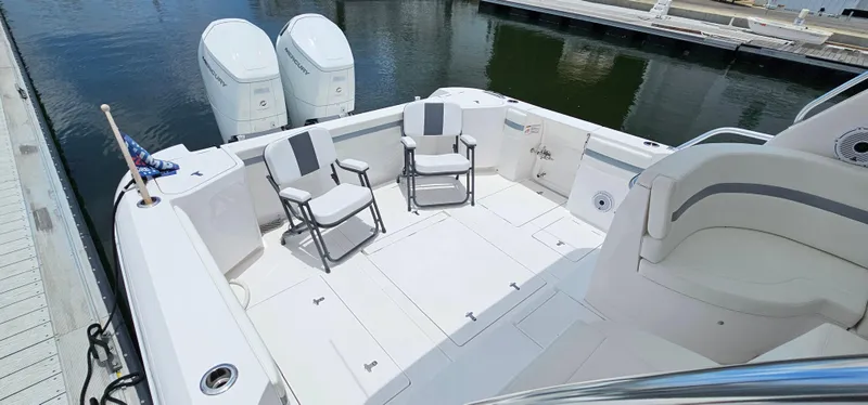 Slide: The Image of 2022 Intrepid 438 Evolution boat with spacious deck and twin outboard engines. - 5