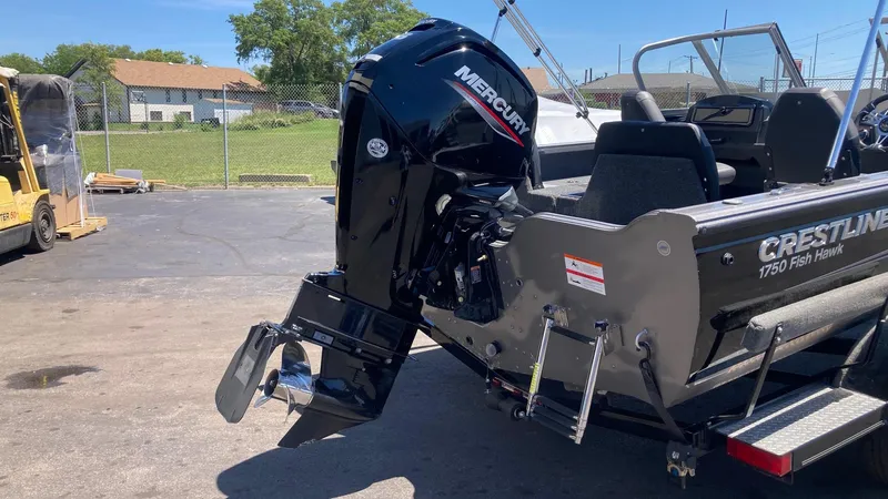 Slide: The Image of 2021 Crestliner 1750 Fish Hawk WT JS boat with Mercury outboard motor. - 2