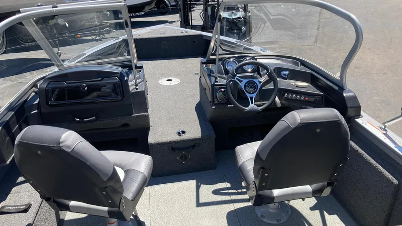 Slide: The Image of 2021 Crestliner 1750 Fish Hawk WT JS boat interior with dual seats and steering console. - 4