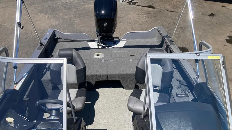 Slide: The Image of 2021 Crestliner 1750 Fish Hawk WT JS boat interior with seating and motor. - 5