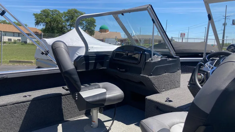 Slide: The Image of 2021 Crestliner 1750 Fish Hawk WT JS boat interior with seating and dashboard. - 7