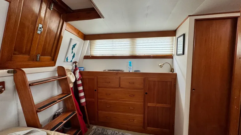 Slide: The Image of Interior of 1969 Grand Banks 42 Classic with wooden cabinetry and nautical decor. - 14