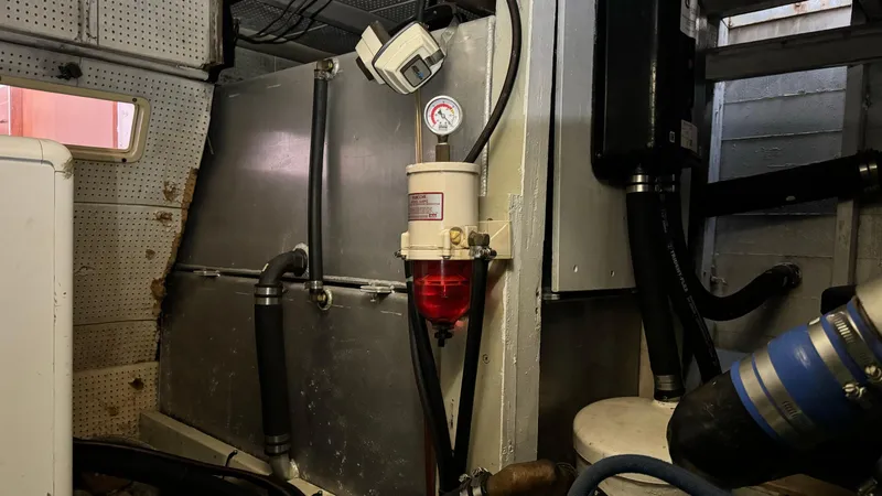 Slide: The Image of Engine room of 1969 Grand Banks 42 Classic with fuel filter and gauge. - 17