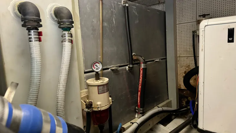 Slide: The Image of Engine room of a 1969 Grand Banks 42 Classic yacht with fuel system components. - 23