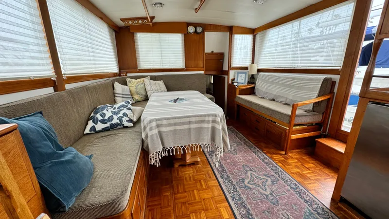 Slide: The Image of Interior of 1969 Grand Banks 42 Classic yacht with cozy seating and elegant decor. - 4
